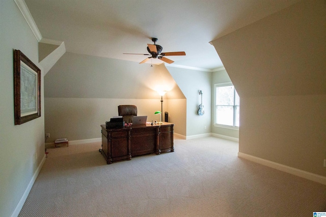 office area featuring crown molding, light colored carpet, a ceiling fan, baseboards, and lofted ceiling