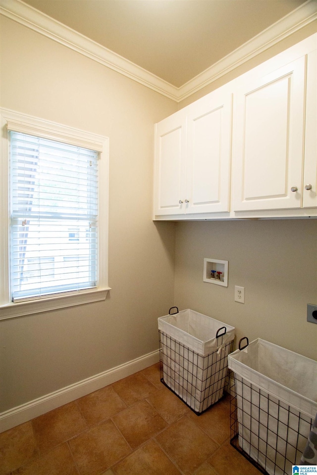 clothes washing area with electric dryer hookup, cabinet space, ornamental molding, baseboards, and hookup for a washing machine