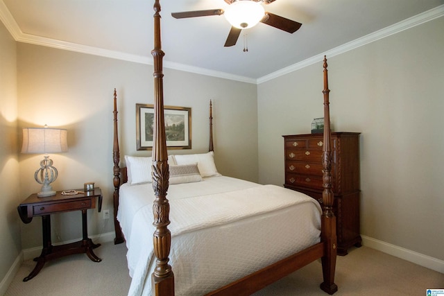 carpeted bedroom with crown molding, baseboards, and ceiling fan