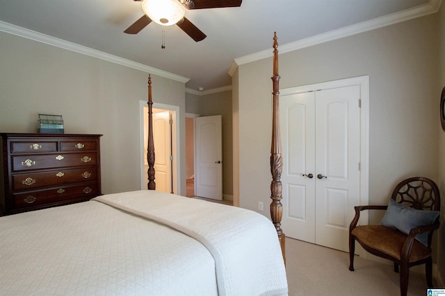 bedroom featuring a closet, light colored carpet, ornamental molding, and ceiling fan