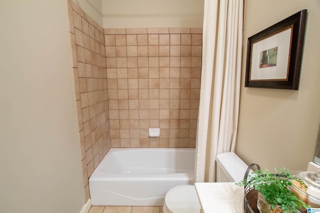 bathroom featuring toilet, shower / bath combo, tile patterned flooring, and vanity