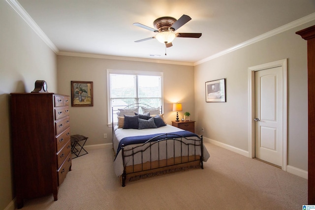 bedroom with light colored carpet, crown molding, baseboards, and a ceiling fan