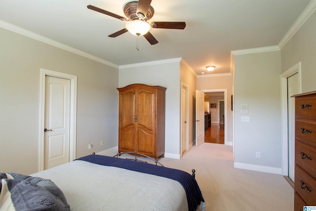 bedroom with crown molding, baseboards, light colored carpet, and ceiling fan