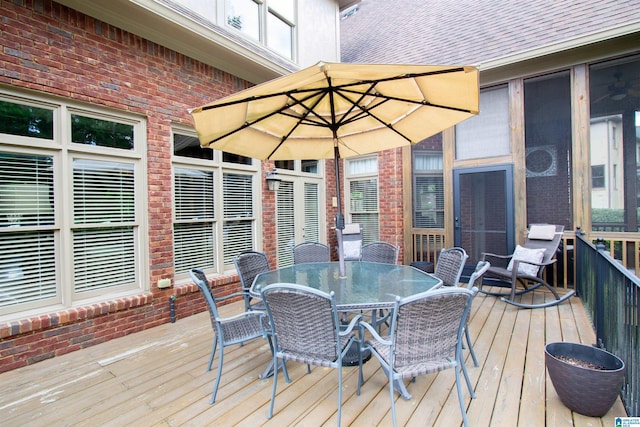 wooden deck with outdoor dining area