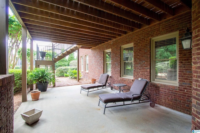view of patio featuring stairway
