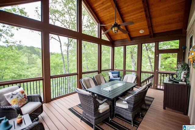 sunroom / solarium with outdoor dining area, ceiling fan, and beamed ceiling