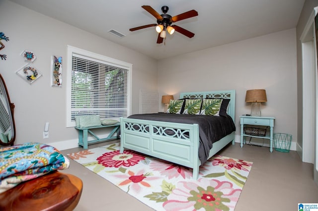 bedroom featuring baseboards, a ceiling fan, and visible vents