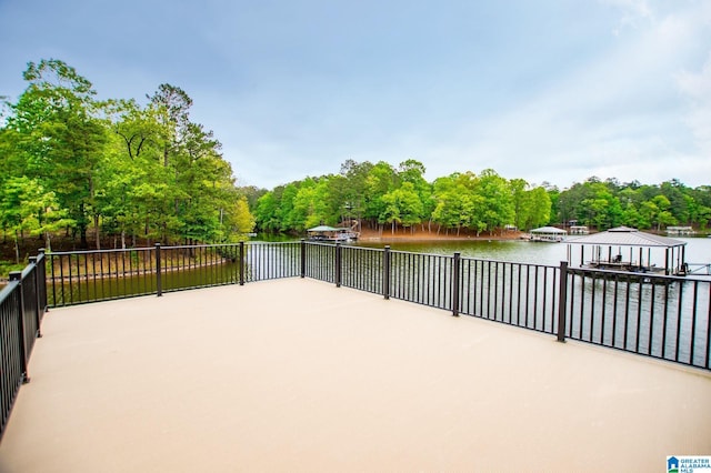 view of patio / terrace with a gazebo and a water view