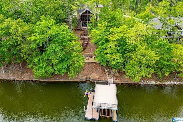 view of dock featuring stairs and a water view