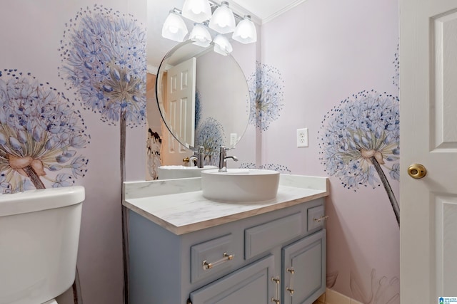bathroom featuring toilet and vanity