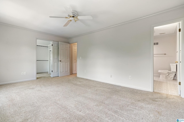 unfurnished bedroom featuring carpet floors, crown molding, and visible vents