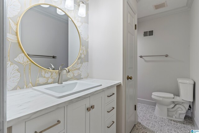 bathroom featuring visible vents, crown molding, vanity, and toilet