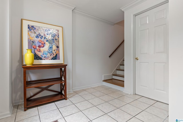 stairs featuring crown molding and baseboards