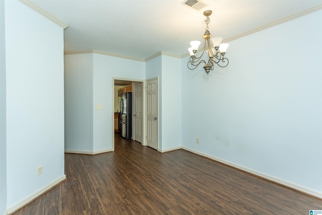 empty room featuring crown molding, visible vents, baseboards, an inviting chandelier, and dark wood finished floors