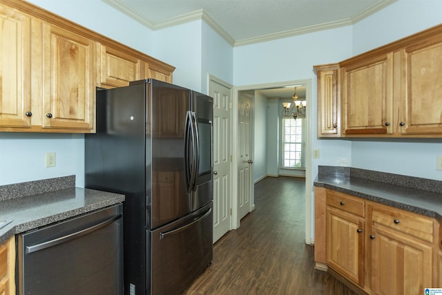 kitchen featuring appliances with stainless steel finishes, dark countertops, an inviting chandelier, ornamental molding, and dark wood finished floors