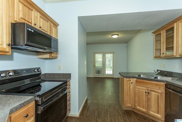 kitchen featuring electric stove, ornamental molding, dark countertops, dishwasher, and a sink