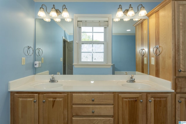 full bathroom with ornamental molding, double vanity, and a sink
