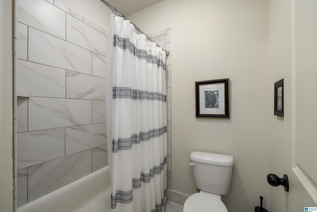 bathroom featuring toilet and shower / tub combo with curtain