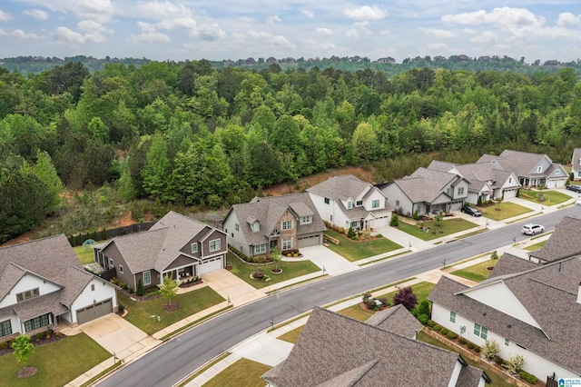 aerial view featuring a view of trees and a residential view