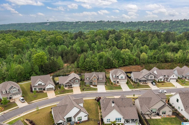 aerial view with a forest view and a residential view