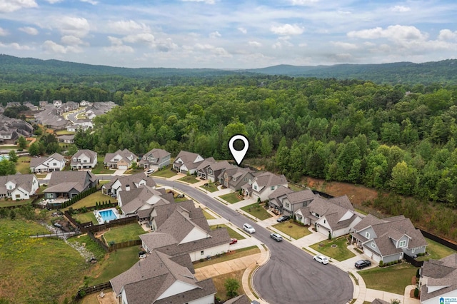aerial view with a residential view and a wooded view
