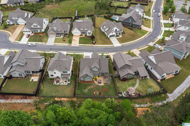 birds eye view of property with a residential view
