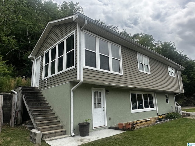 129 Hurricane Creek Rd, Adger, AL 35006 - rear view of house featuring stairs and a yard