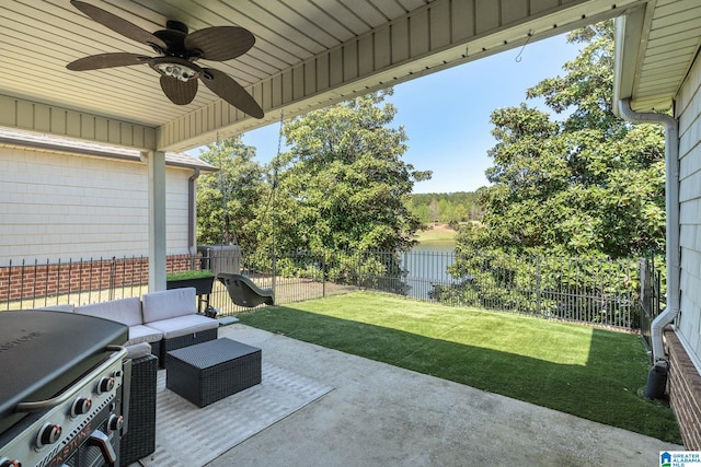 view of patio / terrace featuring a fenced backyard, area for grilling, ceiling fan, and an outdoor hangout area