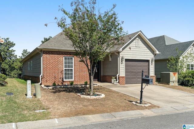 view of front of property with roof with shingles, an attached garage, driveway, brick siding, and a front yard