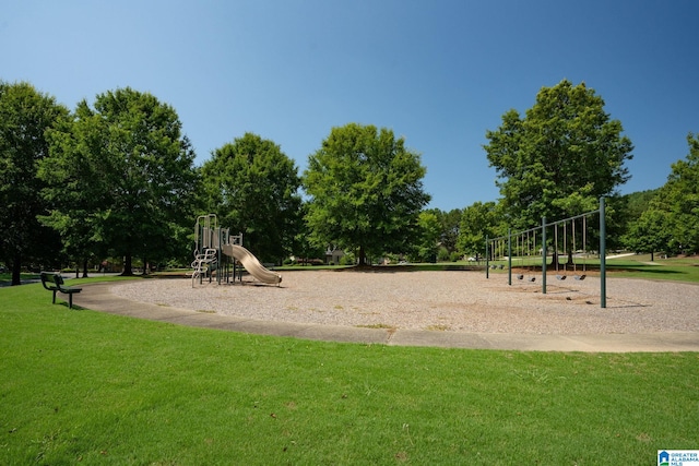 communal playground featuring a lawn