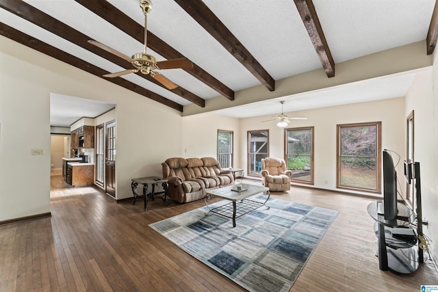 108 Dee Hendrix Rd, Hueytown, AL 35023 - living area featuring ceiling fan, baseboards, dark wood-style flooring, and lofted ceiling with beams