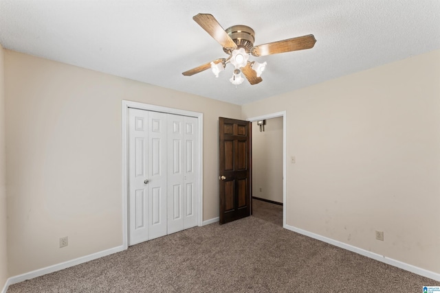 108 Dee Hendrix Rd, Hueytown, AL 35023 - unfurnished bedroom with baseboards, carpet floors, ceiling fan, and a closet