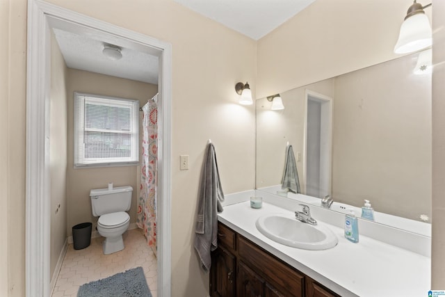 108 Dee Hendrix Rd, Hueytown, AL 35023 - full bathroom with baseboards, toilet, vanity, and tile patterned floors