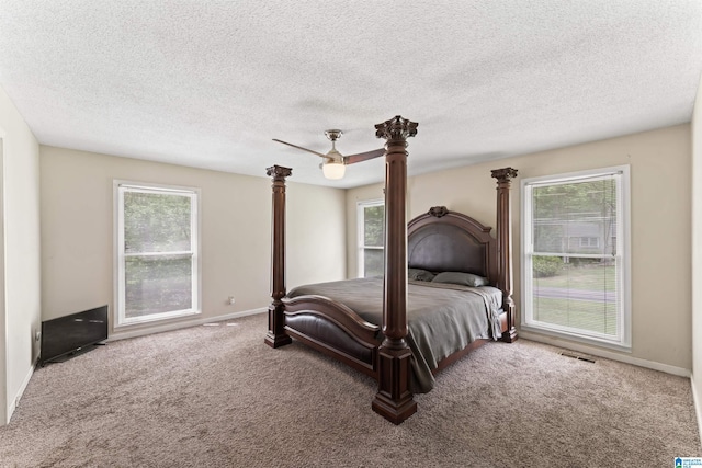 108 Dee Hendrix Rd, Hueytown, AL 35023 - bedroom featuring ceiling fan, multiple windows, visible vents, and carpet
