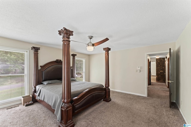 108 Dee Hendrix Rd, Hueytown, AL 35023 - carpeted bedroom with multiple windows, visible vents, and a textured ceiling