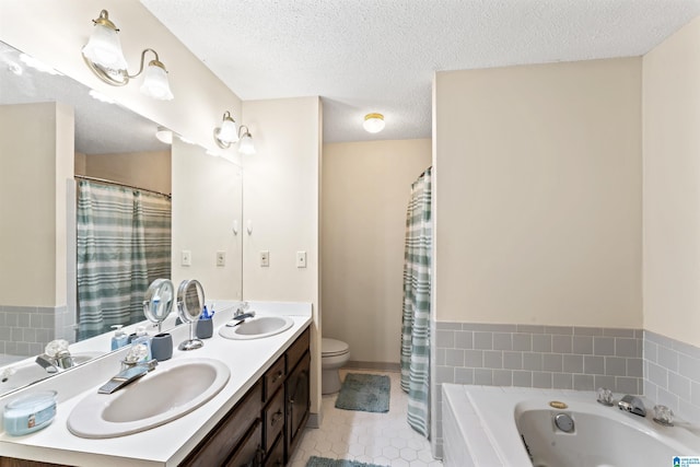 108 Dee Hendrix Rd, Hueytown, AL 35023 - full bathroom featuring tile patterned flooring, a sink, a textured ceiling, and a bathing tub