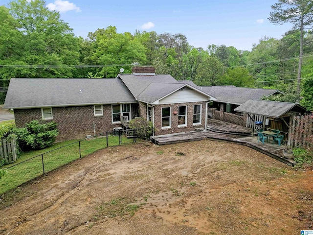 108 Dee Hendrix Rd, Hueytown, AL 35023 - rear view of property featuring brick siding, a chimney, a fenced backyard, and a deck