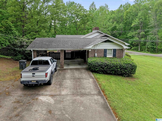 108 Dee Hendrix Rd, Hueytown, AL 35023 - ranch-style house with a chimney, a front lawn, driveway, an attached carport, and brick siding