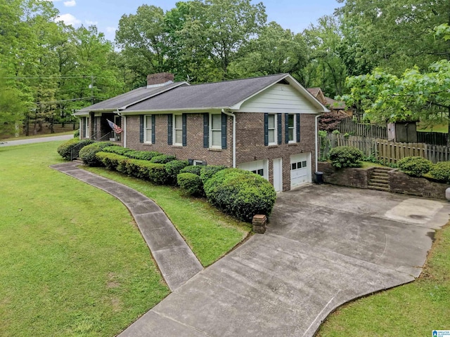 108 Dee Hendrix Rd, Hueytown, AL 35023 - view of front facade with a garage, concrete driveway, a chimney, a front yard, and brick siding