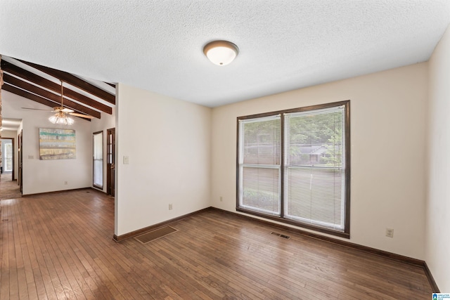 108 Dee Hendrix Rd, Hueytown, AL 35023 - unfurnished room featuring wood-type flooring, visible vents, a ceiling fan, and lofted ceiling with beams