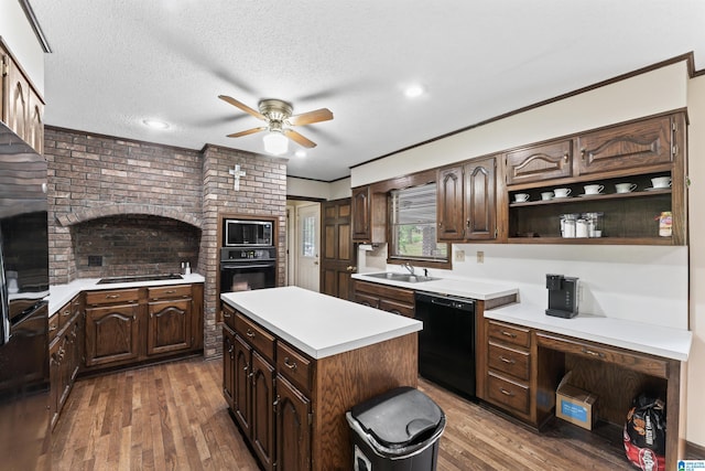 108 Dee Hendrix Rd, Hueytown, AL 35023 - kitchen with light countertops, dark brown cabinets, wood finished floors, a ceiling fan, and black appliances