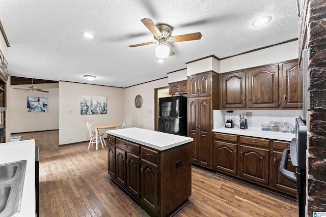 108 Dee Hendrix Rd, Hueytown, AL 35023 - kitchen with hardwood / wood-style floors, light countertops, a ceiling fan, and freestanding refrigerator