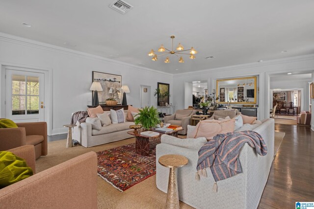 living area with an inviting chandelier, visible vents, crown molding, and dark wood finished floors