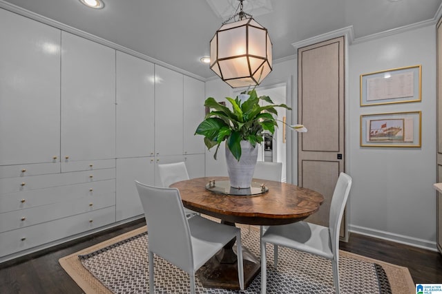 dining room featuring crown molding, dark wood-style floors, and recessed lighting