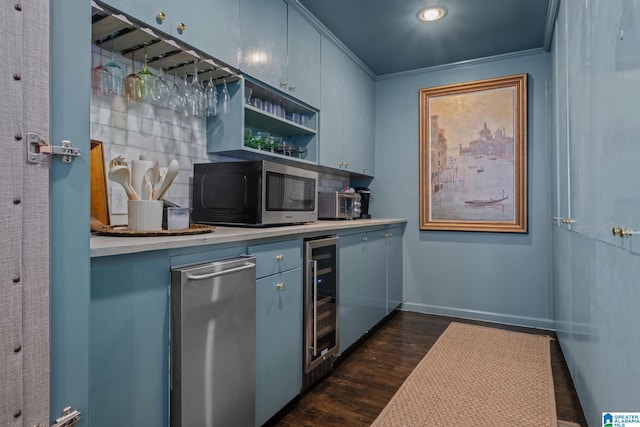 bar with stainless steel microwave, wine cooler, dark wood-type flooring, baseboards, and a dry bar
