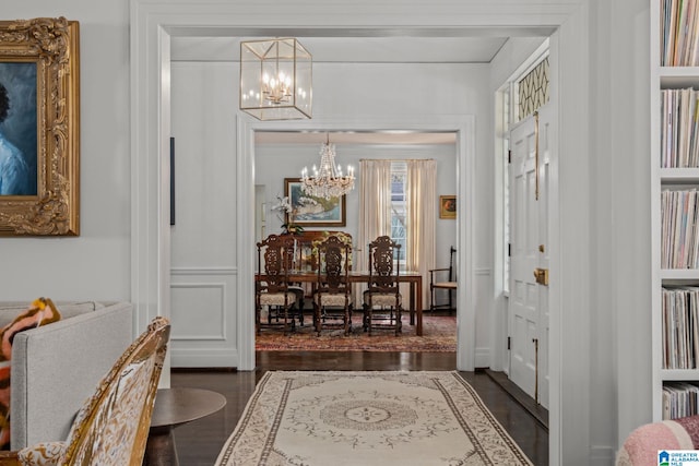 entrance foyer with a chandelier and dark wood finished floors