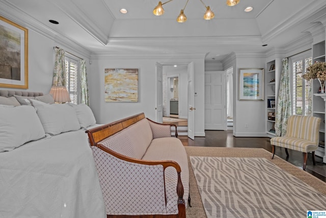 bedroom featuring wood finished floors, crown molding, recessed lighting, and baseboards