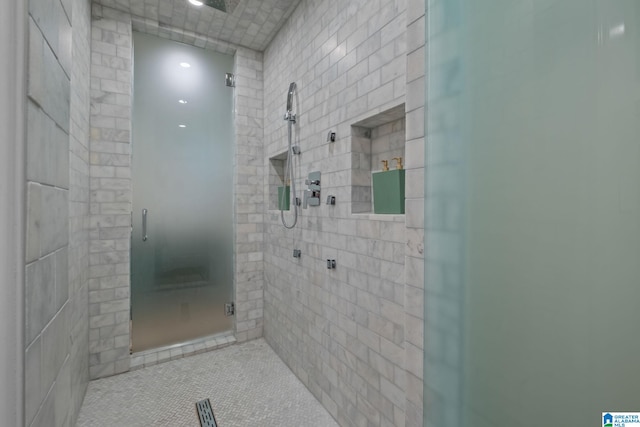 full bathroom with a stall shower and tile patterned flooring