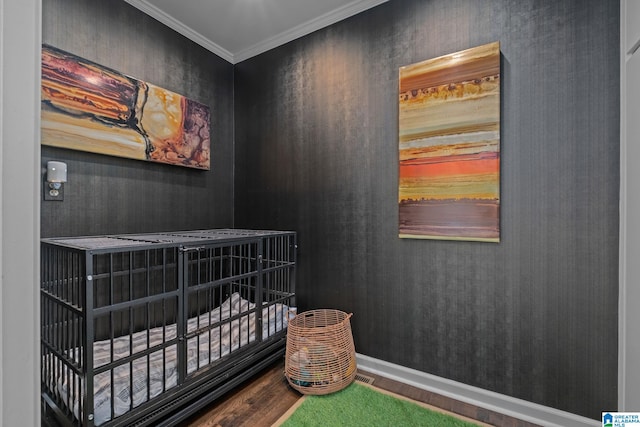 bedroom featuring wood finished floors and crown molding
