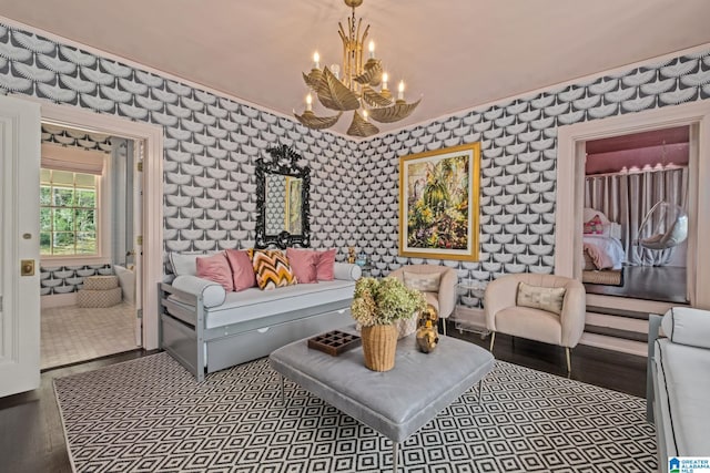 living room with an inviting chandelier and wallpapered walls